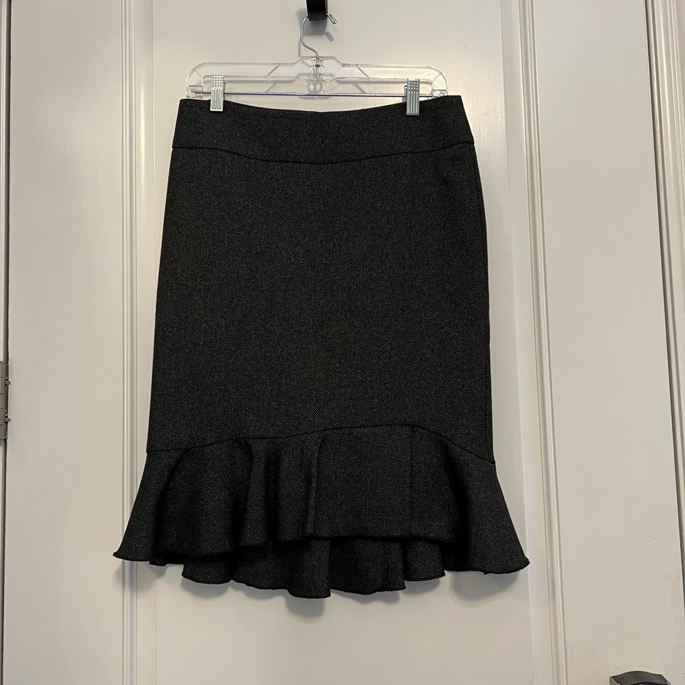 Grey express knee length pencil skirt with trumpet ruffle detail at bottom.